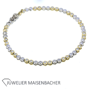 Klassisches Tennisarmband aus Weiß- und Gelbgold besetzt mit Diamanten